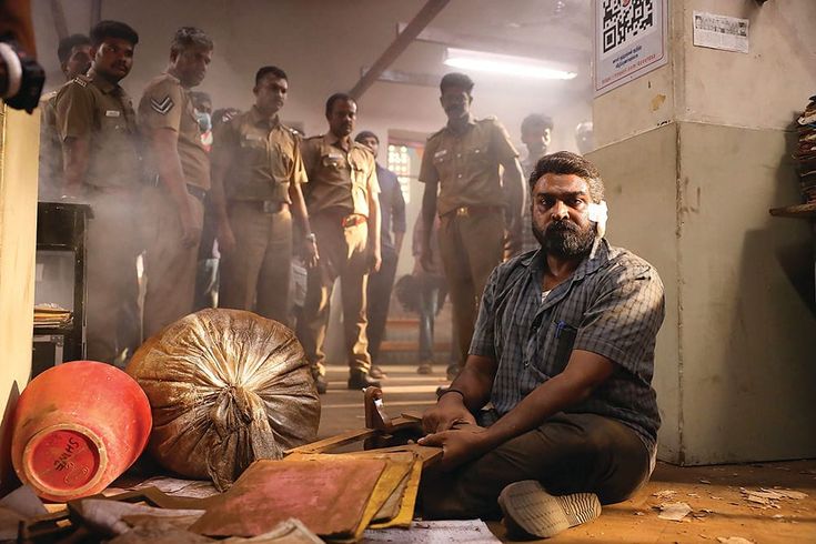 vijay sethupathi sitting on a floor